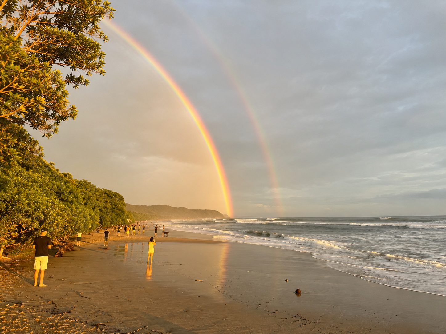 Double rainbow over the beach at sunset in Santa Teresa